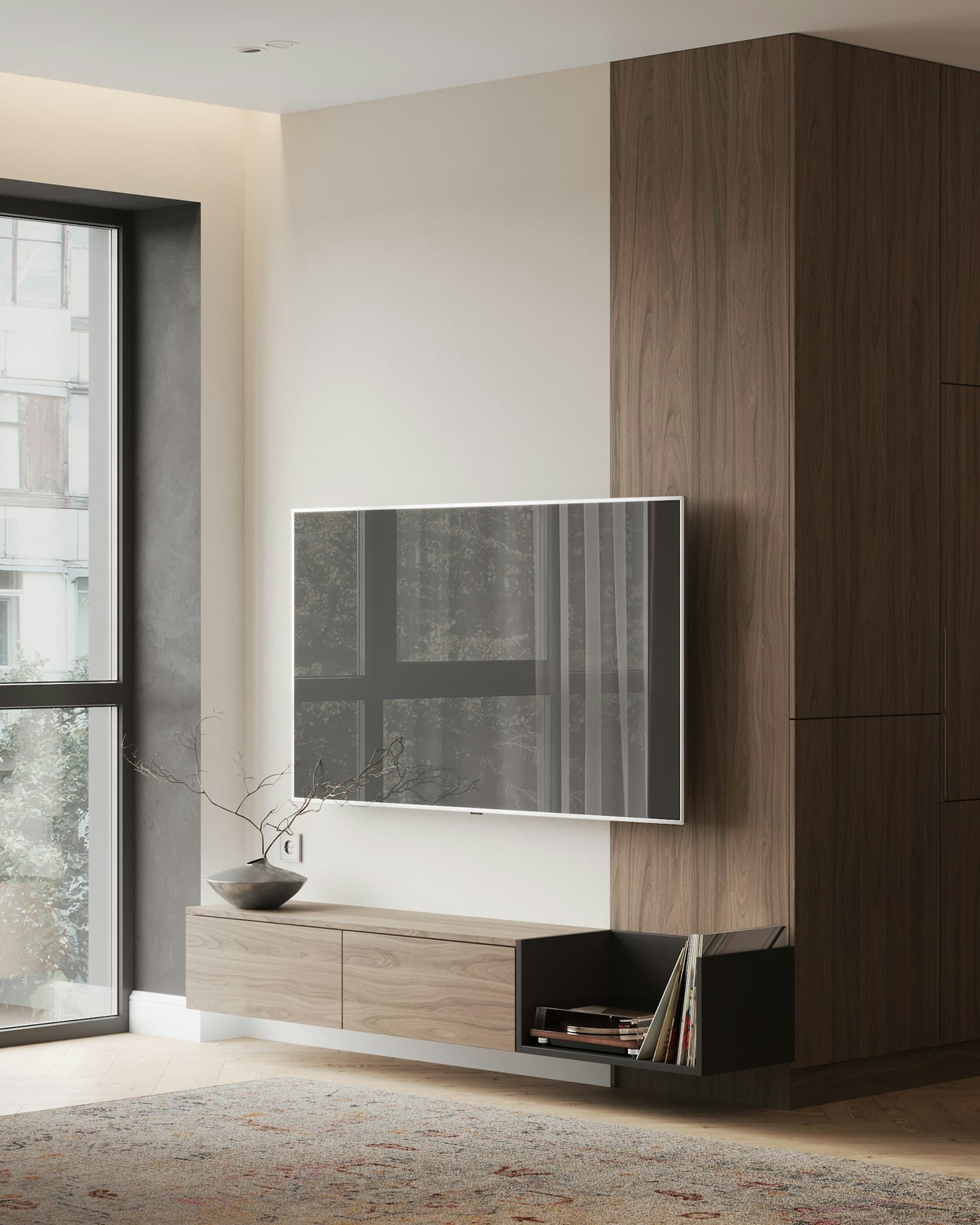 Slim flat-screen TV mounted flush against a pale wall beside a walnut cabinet, no cables showing
